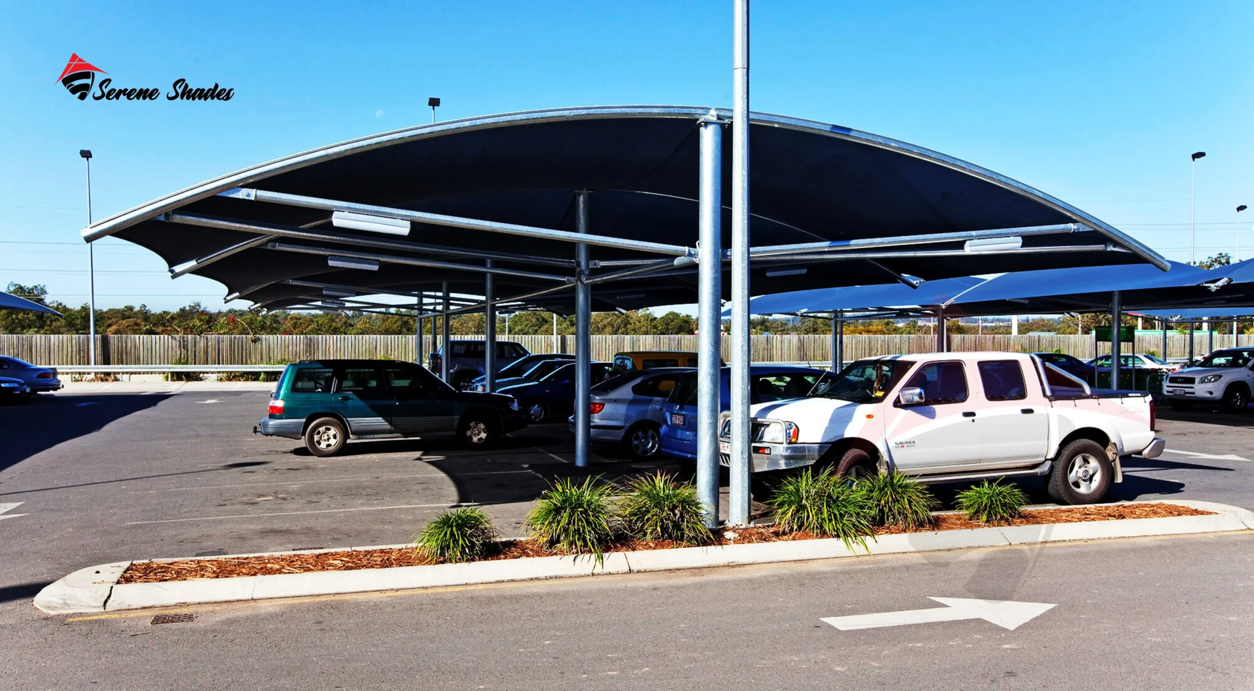 Stylish cantilever shade structure providing car protection from sun and rain