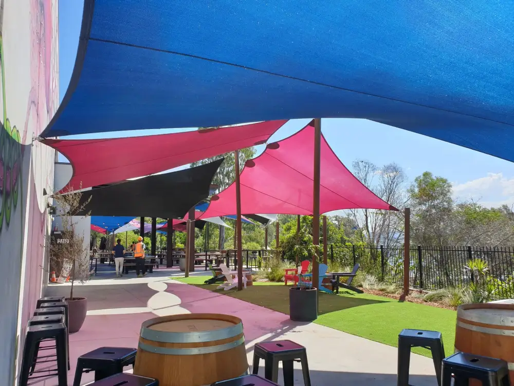 Overlapping Sail Shades providing layered sun protection for outdoor spaces