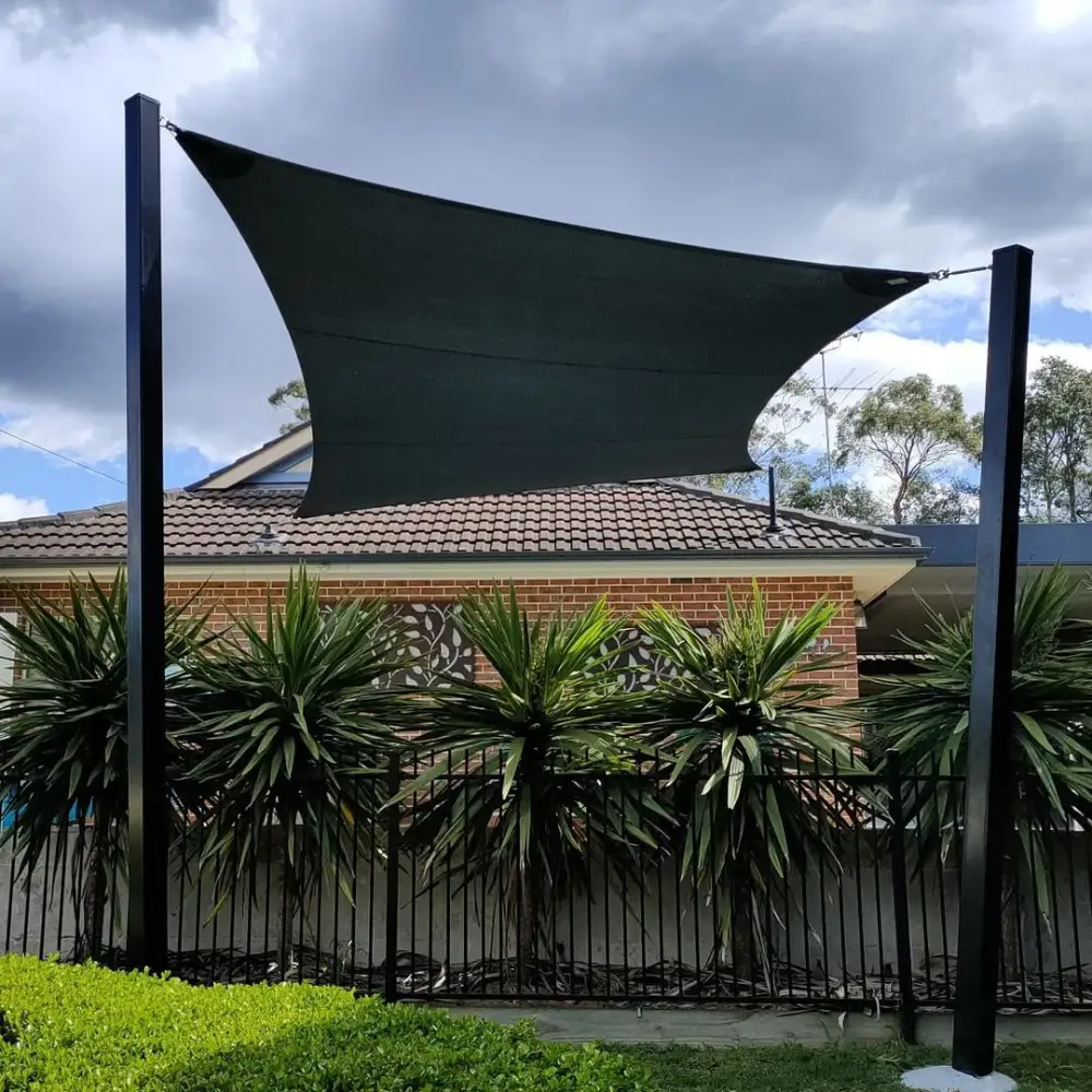 Triangular Sail Shades enhancing a modern patio space